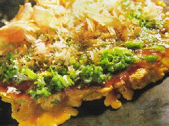 Negi Okonomiyaki. The flakes on the top are katsuobushi